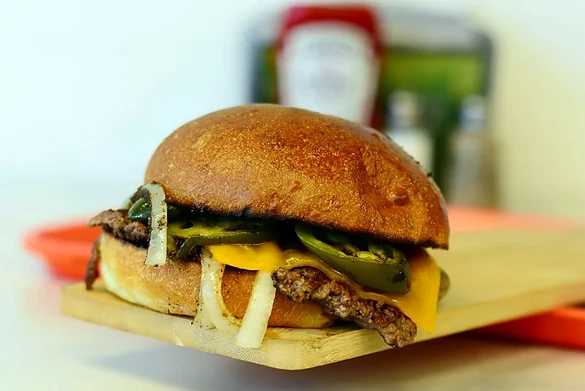 Smash burger with grilled jalapenos and cheddar