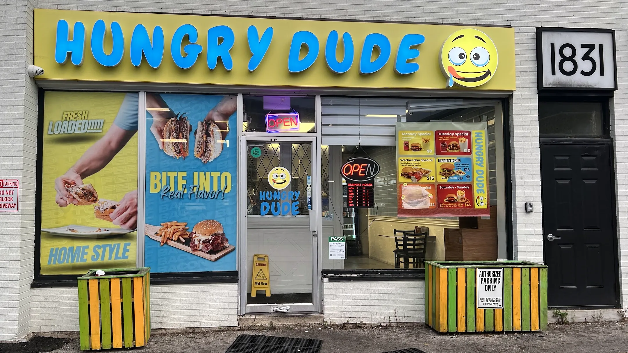 Hungry Dude storefront on Main Street West in Hamilton with the blue and yellow sign
